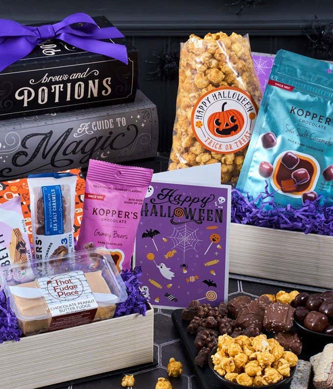 Gift Boxes consisting of 3 fake books. One is filled with Candy Corn, another with Caramel popcorn, and another with Mars & Skittles candy mixes
