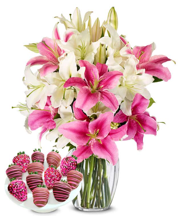 A bouquet featuring pink lilies and white lilies, with an optional glass vase and Chocolate Covered Strawberries
