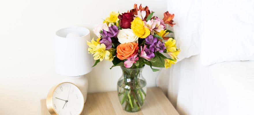 Fall flowers sitting on a bedside table - shop now
