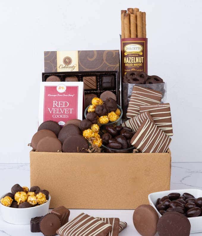 A gift set overflowing with chocolate indulgences including chocolate-covered pretzels, mini cookies, caramel popcorn, chocolate and peanut butter buckeyes, six chocolate-covered Oreos, and a box of assorted truffles for a luxurious touch.