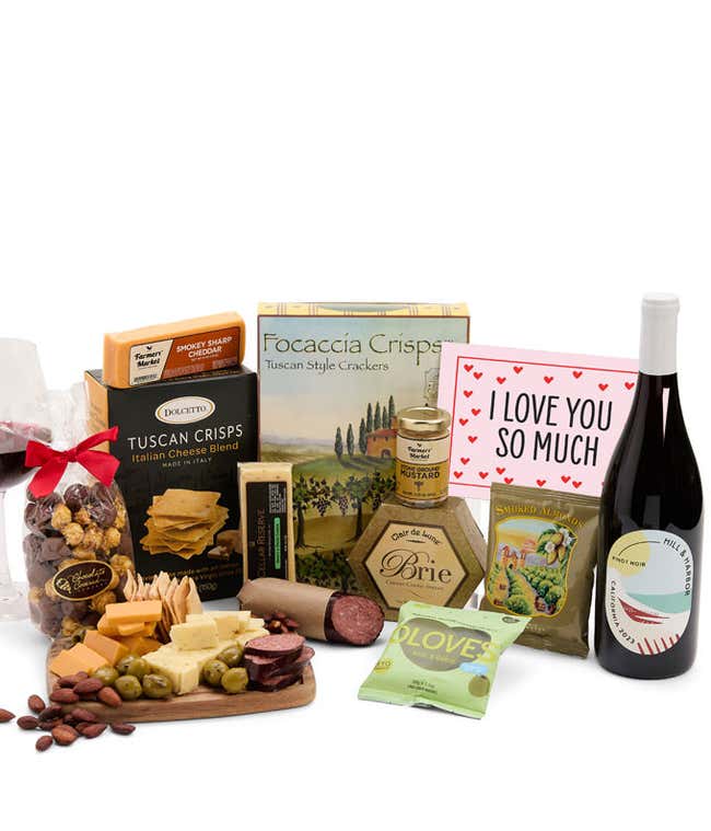 A luxurious gift box with two bottles of Hill &amp; Harbor wine (red &amp; white), three cheeses, gourmet crackers, summer sausage, marinated olives, smoked almonds, stone-ground mustard, chocolate-covered, and a pink 'I Love You So Much' card
