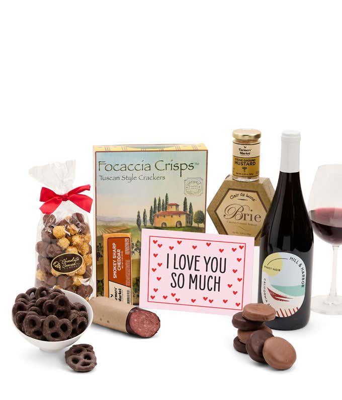 A gift featuring Hill & Harbor Pinot Noir, smoky sharp cheddar, Brie cheese, focaccia crisps, summer sausage, stone-ground mustard, chocolate-covered pretzels, chocolate-dipped cookies, caramel popcorn, and an 'I Love You So Much' message.