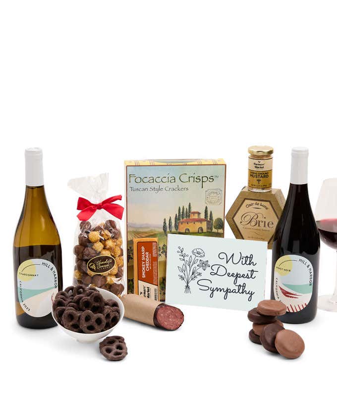 A gift set featuring two bottles of Hill & Harbor wine - white and red, focaccia crisps, two cheeses, mustard, summer sausage, caramel popcorn, chocolate pretzels, six chocolate-covered Oreos and a Sympathy card to show your support.