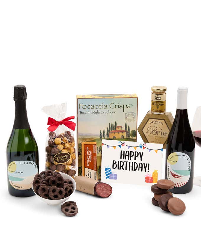 A gift set featuring 2 bottles of Hill & Harbor wine - red and sparkling, focaccia crisps, two cheeses, mustard, summer sausage, caramel popcorn, chocolate pretzels, six chocolate-covered Oreos and a Birthday card to complete the gourmet experience.