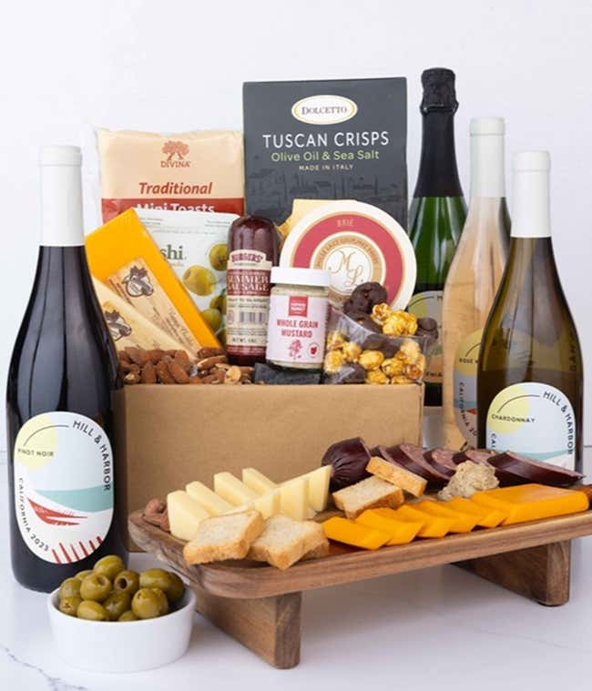 A wine and cheese gift set featuring 4 bottles of Hill &amp; Harbor - Sparkling wine, Ros&eacute; wine, Chardonnay, and Pinot Noir. Includes a variety of cheeses, crackers, olives, smoked almonds, summer sausage, and condiments.