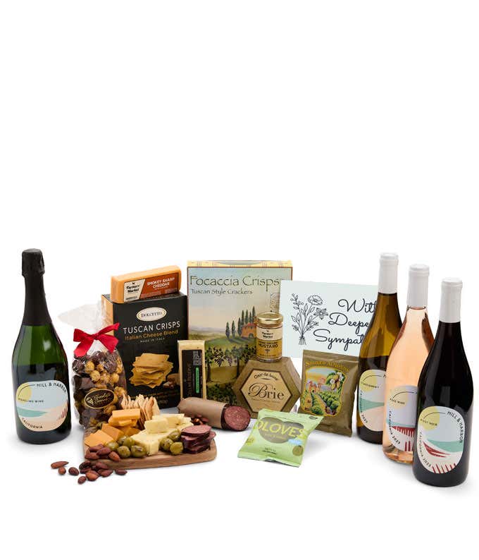 A wine and cheese gift set featuring 4 bottles of Hill & Harbor wine - red, white, rosé and sparkling. Includes a variety of gourmet cheeses, crackers, olives, almonds, sausage, and condiments finished with a Sympathy Card.