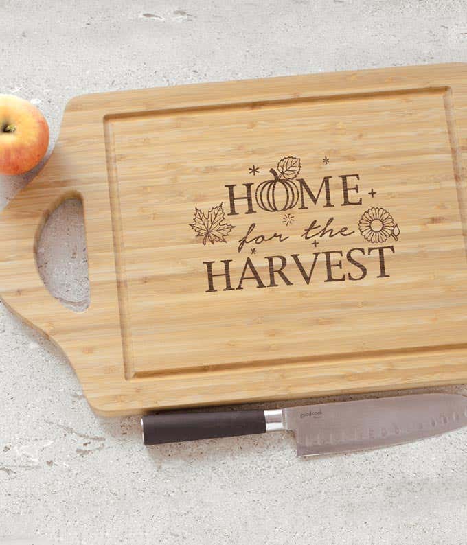 Bamboo cutting board with 'Home for the Harvest' engraved