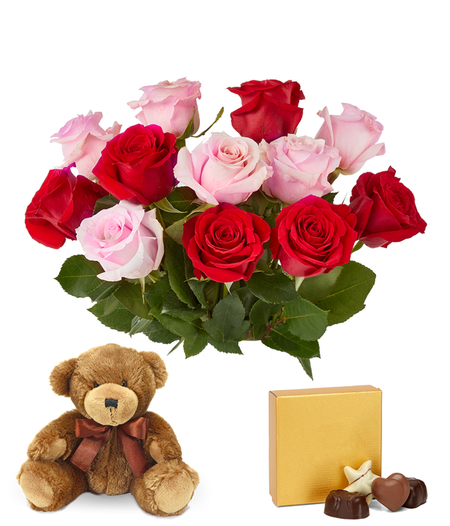 Partial image of Pink and red roses with chocolates and a bear without vase.